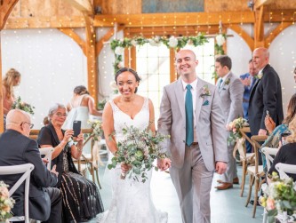 Just said I do in the barn, smiling bride and groom walking back down the aisle, Kaitlyn Ferris photo